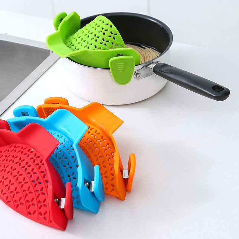 Petra store colorful Pot Side Drain Stopper clips attached to pot for easy draining and straining