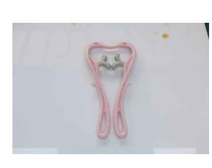 Petra store Six-Wheel Neck Massager in pink handheld design with ergonomic handles for soothing neck relief