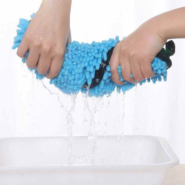 Petra store Super Absorbent Pets Bathrobe being wrung out with water dripping from blue microfiber material