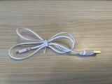 White USB charging cable for Thermal Neck Lifting And Massager from Petra store on wooden surface