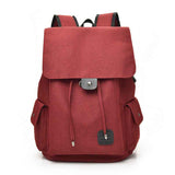 Red travel backpack for teenage girls from Petra store with front flap and side pockets