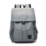 Gray stylish travel backpack for teenage girls with multiple pockets and flap closure from Petra store