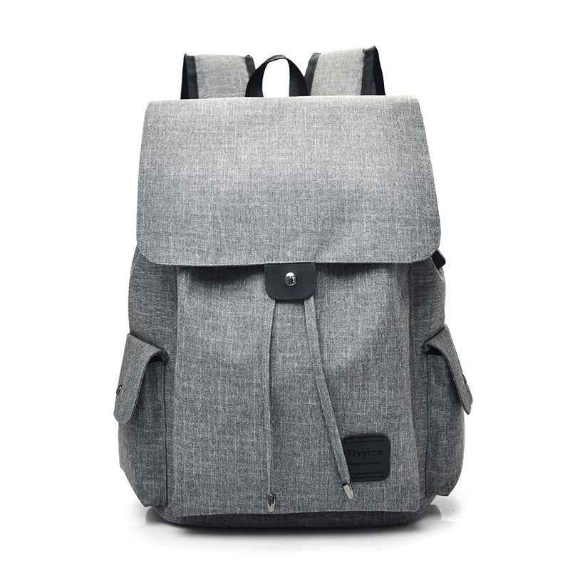 Gray stylish travel backpack for teenage girls with multiple pockets and flap closure from Petra store