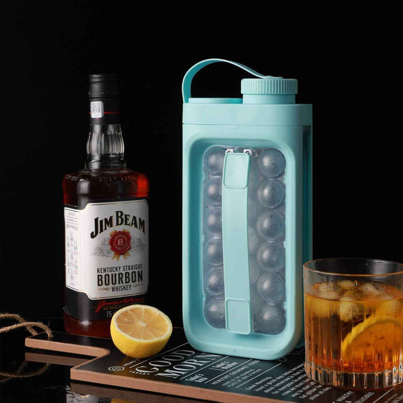 Petra store portable ice ball maker kettle teal carrying case with 12 spherical ice molds next to bourbon glass