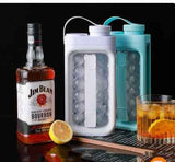 Petra store portable ice ball maker kettle duo in white and teal next to whiskey bottle glass and lemon slice