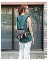 Petra store stylish bag for women small black leather backpack with buckle adjustable straps worn by model