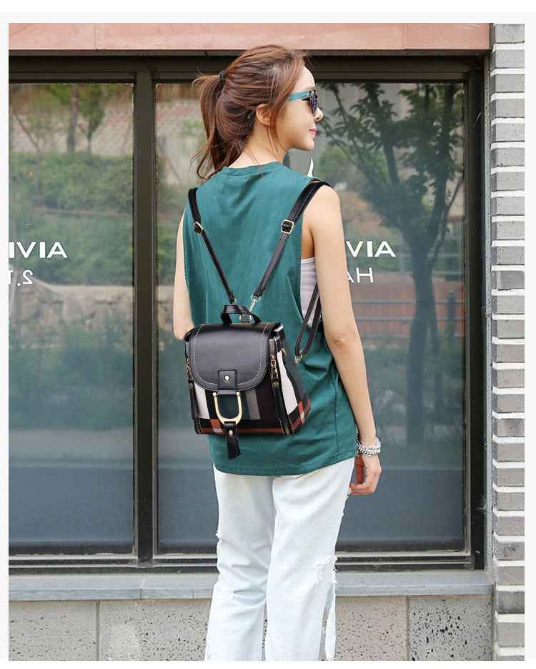 Petra store stylish bag for women small black leather backpack with buckle adjustable straps worn by model