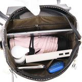 Petra store stylish bag for women open top view showing organized interior with pink umbrella power bank tablet and phone