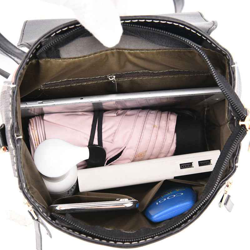 Petra store stylish bag for women open top view showing organized interior with pink umbrella power bank tablet and phone