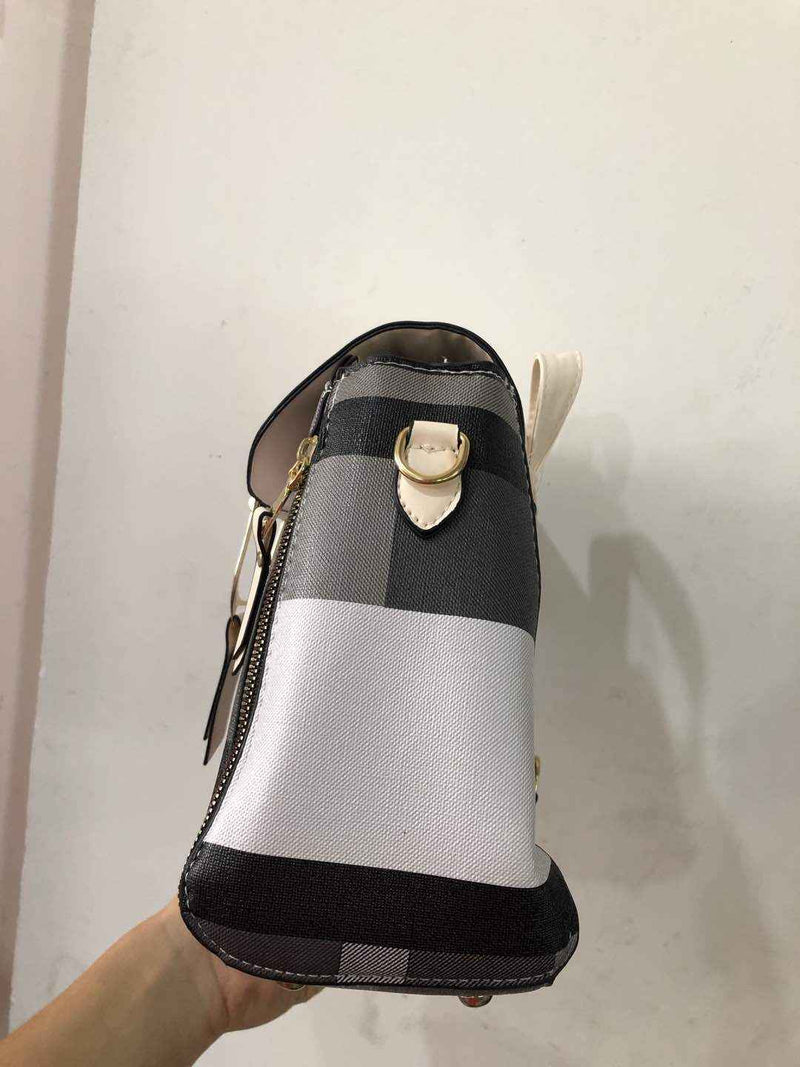 Petra store striped black gray white crossbody stylish bag for women side view with gold hardware