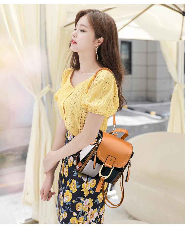 Petra store stylish bag for women tan and black leather satchel with gold buckle worn crossbody with striped strap