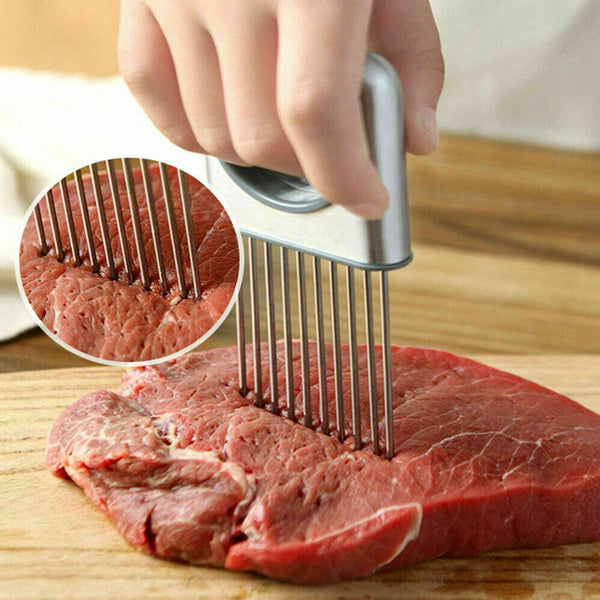 Petra store Vegetable Holder and Slicer with stainless steel blades piercing raw meat on wooden cutting board