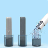 Petra store Mini Cleaning Mop in gray and black colors shown with water pouring for cleaning