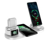 Wireless Charger For Smartphones from Petra store charging smartphone smartwatch and earbuds on a sleek white stand