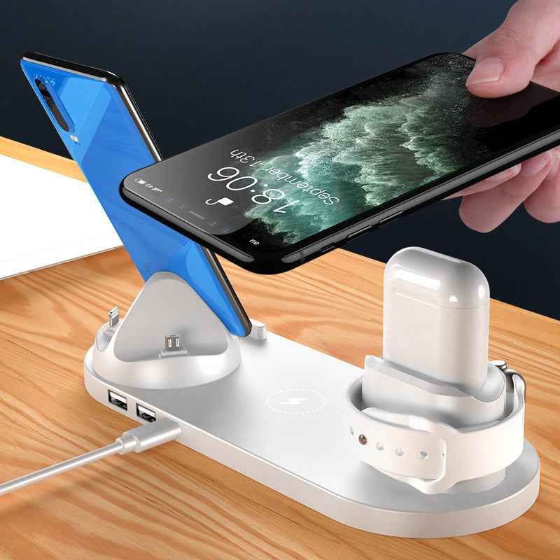 Petra store wireless charger for smartphones with multiple device charging dock on wooden table