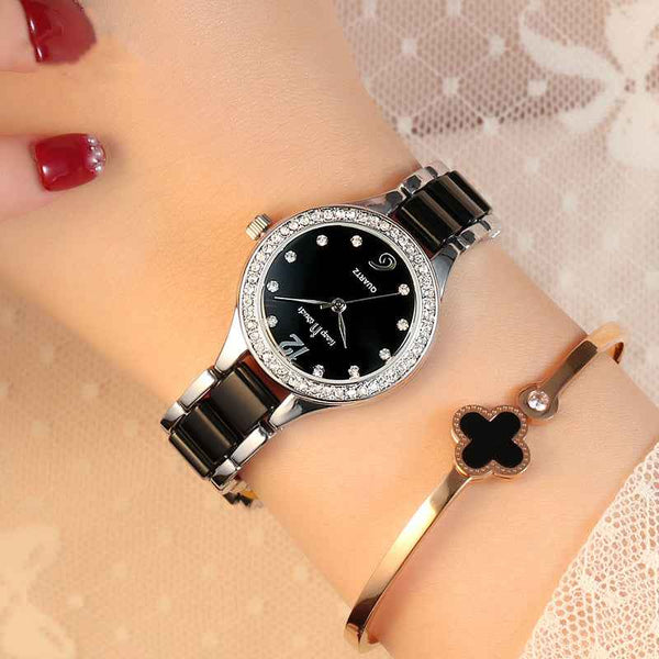 Women's Luxury Quartz Watch with black dial and silver accents on wrist from Petra store