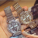 Petra store women's quartz watch with sparkling crystal-studded bands and glittery dials in silver and gold tones